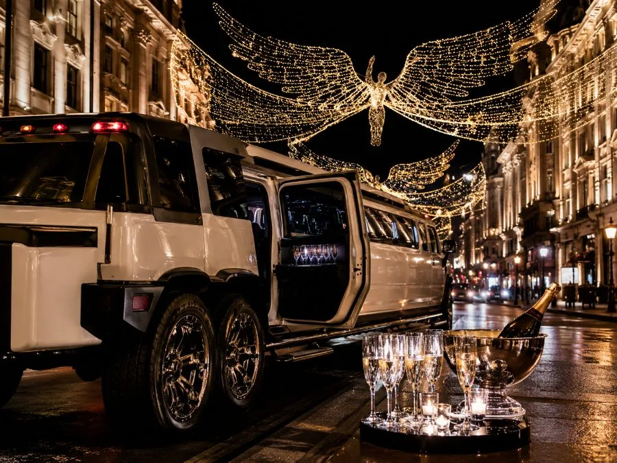 White Hummer limousine on Regent Street with champagne